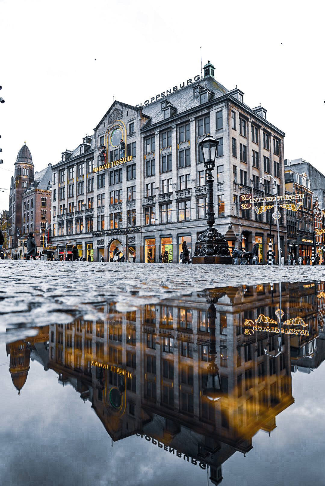 Amsterdam de Dam puddle reflection