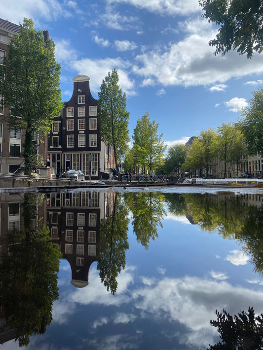 Amsterdam canal puddle reflection